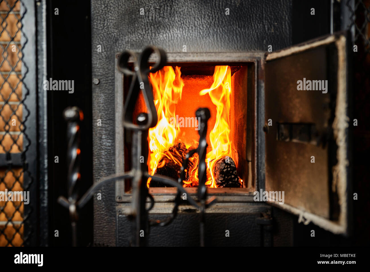Redyellow flames in the furnace of the old furnace Stock Photo Alamy