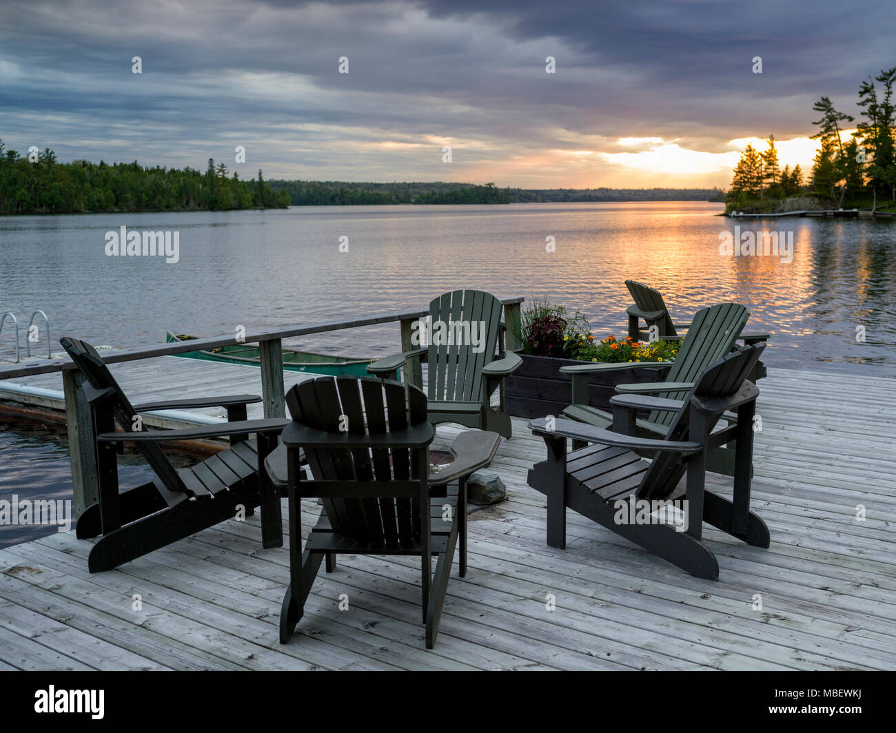 Adirondack chair on a dock, Kenora, Lake of the Woods, Ontario, Canada ...