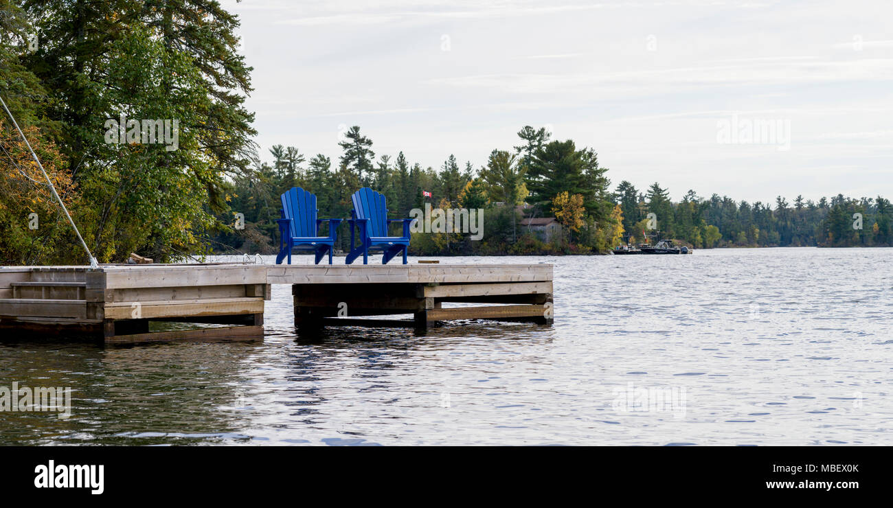 Adirondack chairs on a dock, Kenora, Lake of The Woods, Ontario, Canada ...