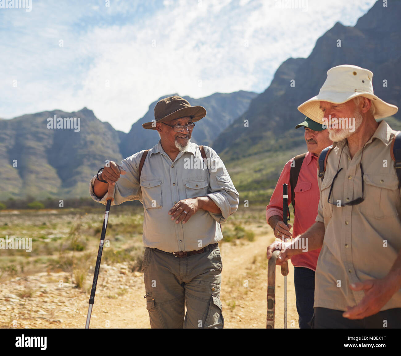 Active senior men friends hiking Stock Photo