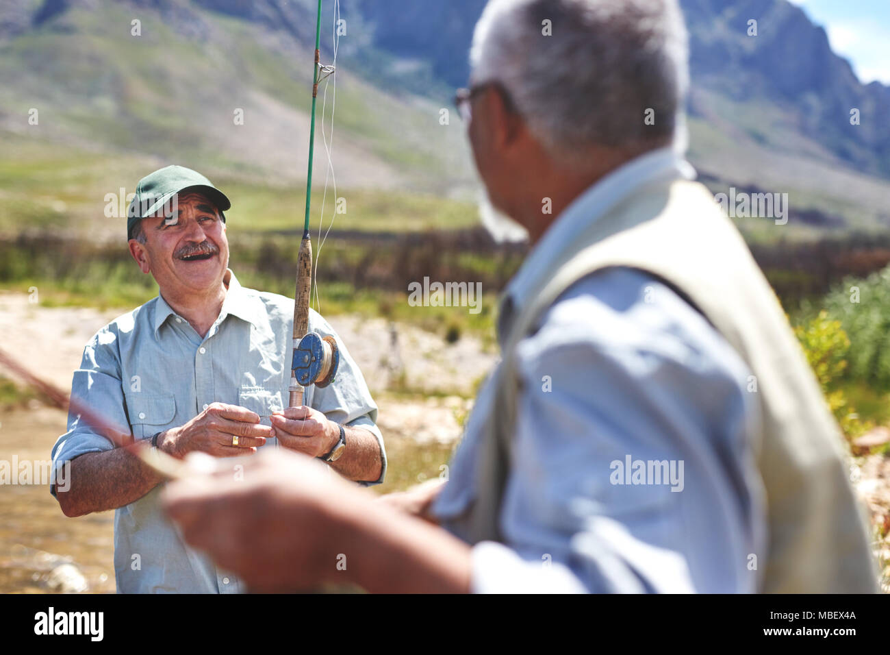 Smiling active senior men fishing Stock Photo