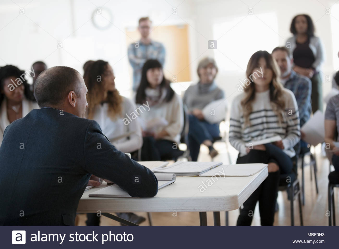 Speaker and audience talking at town hall meeting Stock Photo Alamy