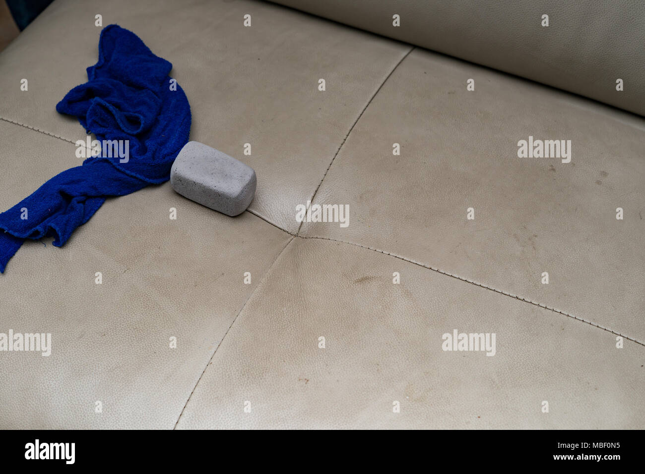 cleaning leather sofa with towel and sponge Stock Photo Alamy