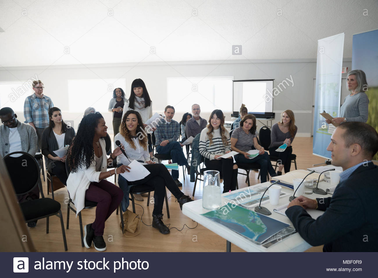 Women Speaking At Town Hall Meeting Stock Photo Alamy
