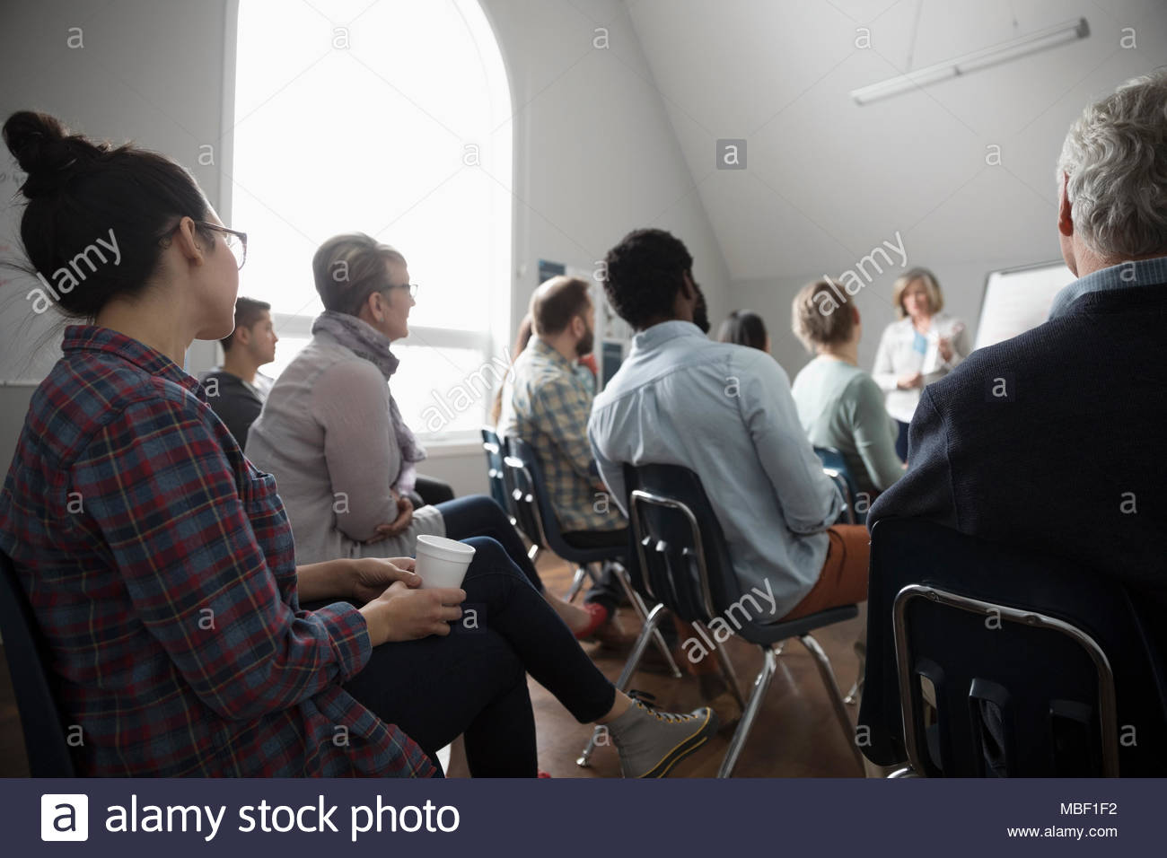 Support group listening in community center Stock Photo Alamy