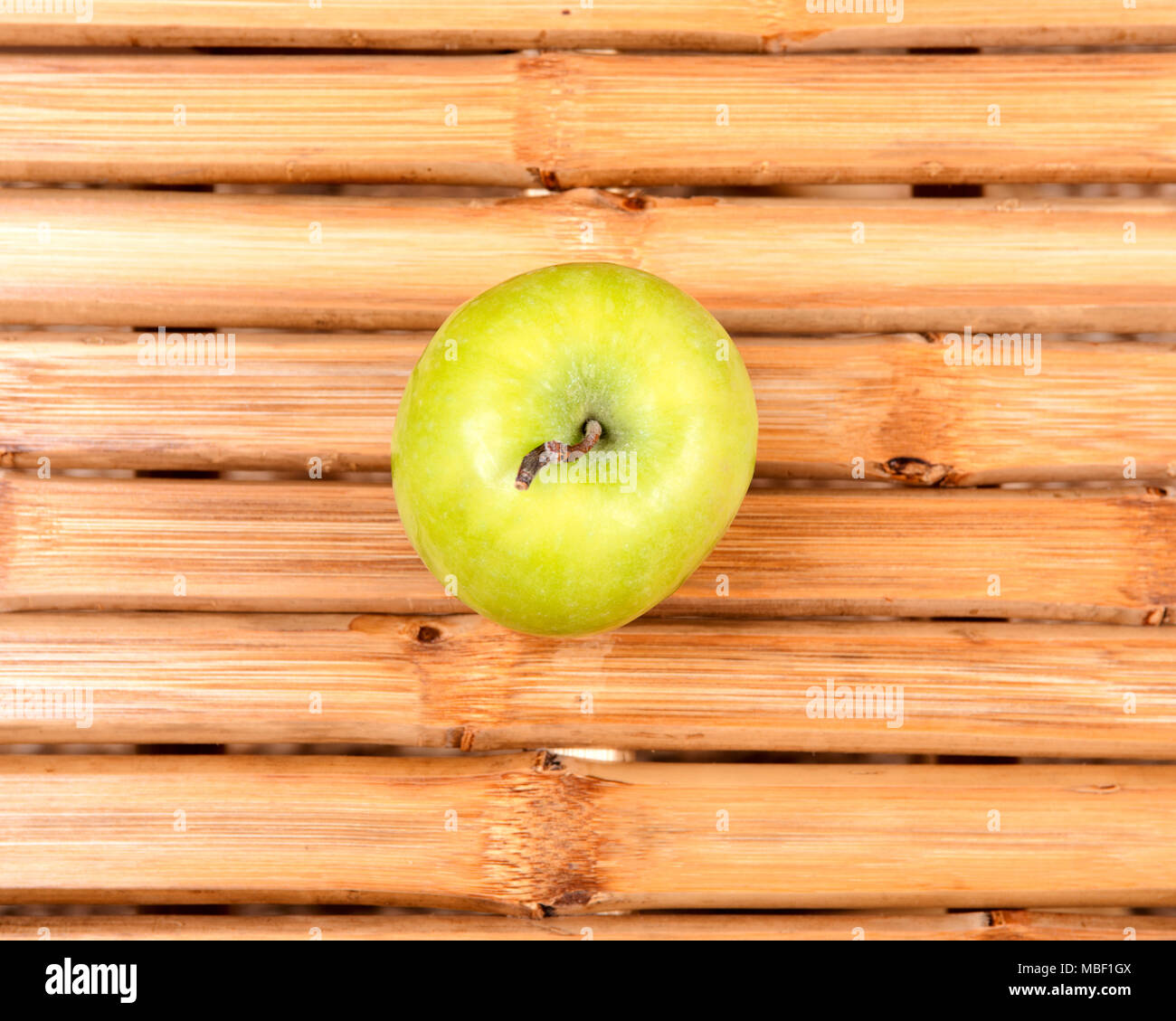 Organic granny smith apples on bamboo table Stock Photo Alamy