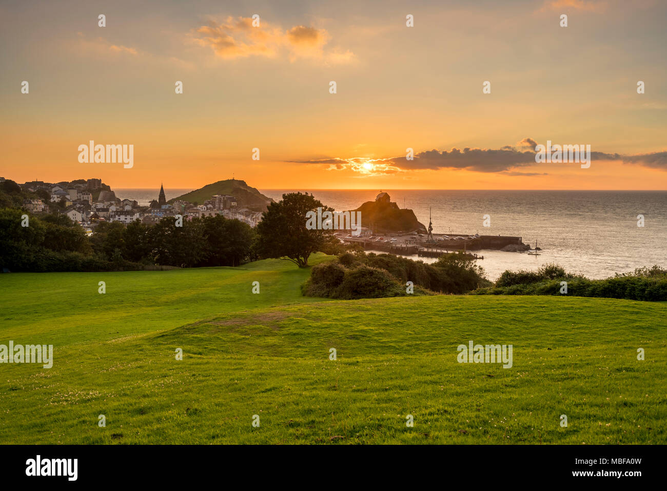 Ilfracombe, Devon at sunset with view over the harbour and town, England UK Stock Photo