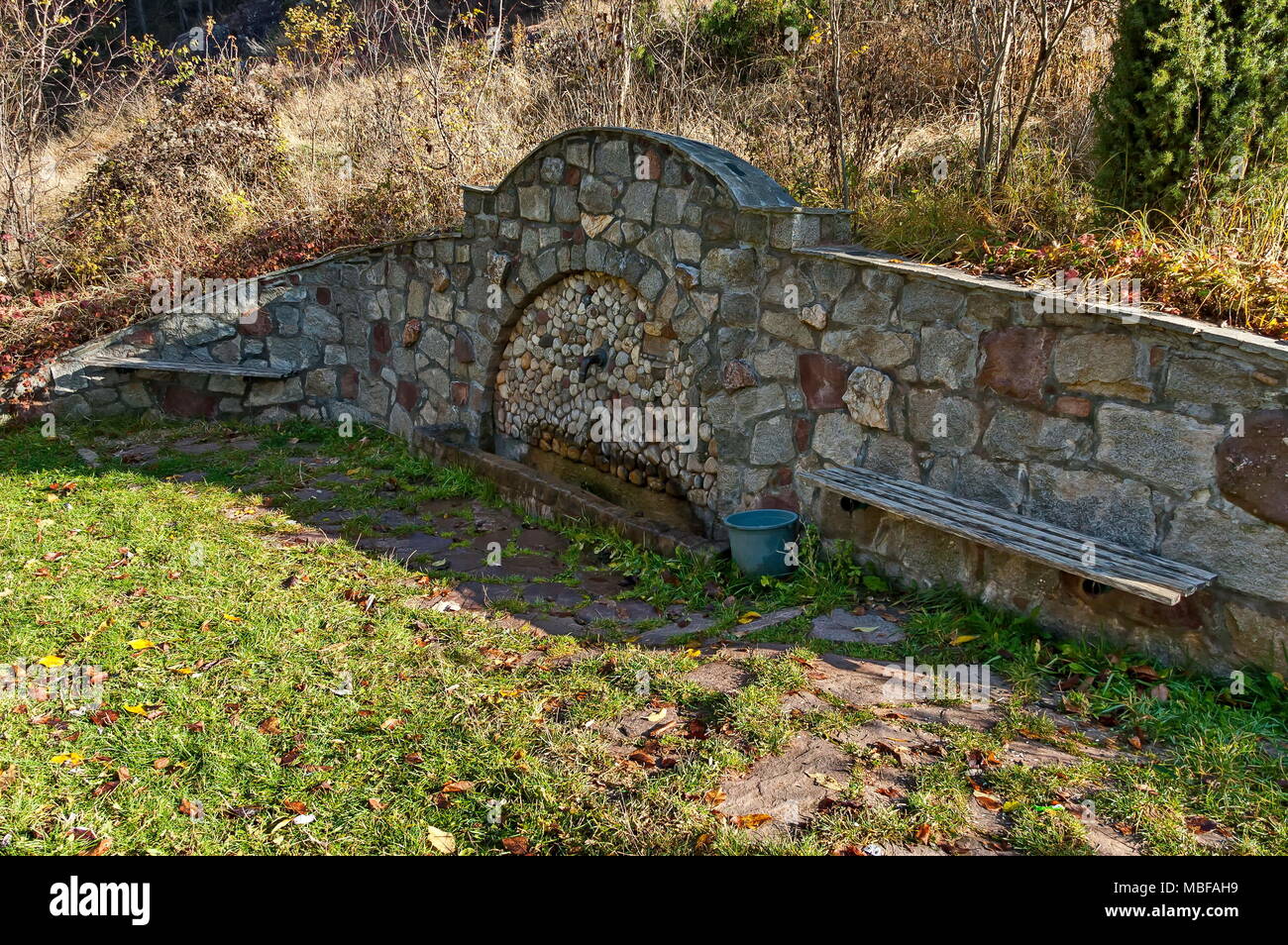 Fresh water gush from  old fountain in the Balkan mountain, near village Lokorsko, Bulgaria Stock Photo