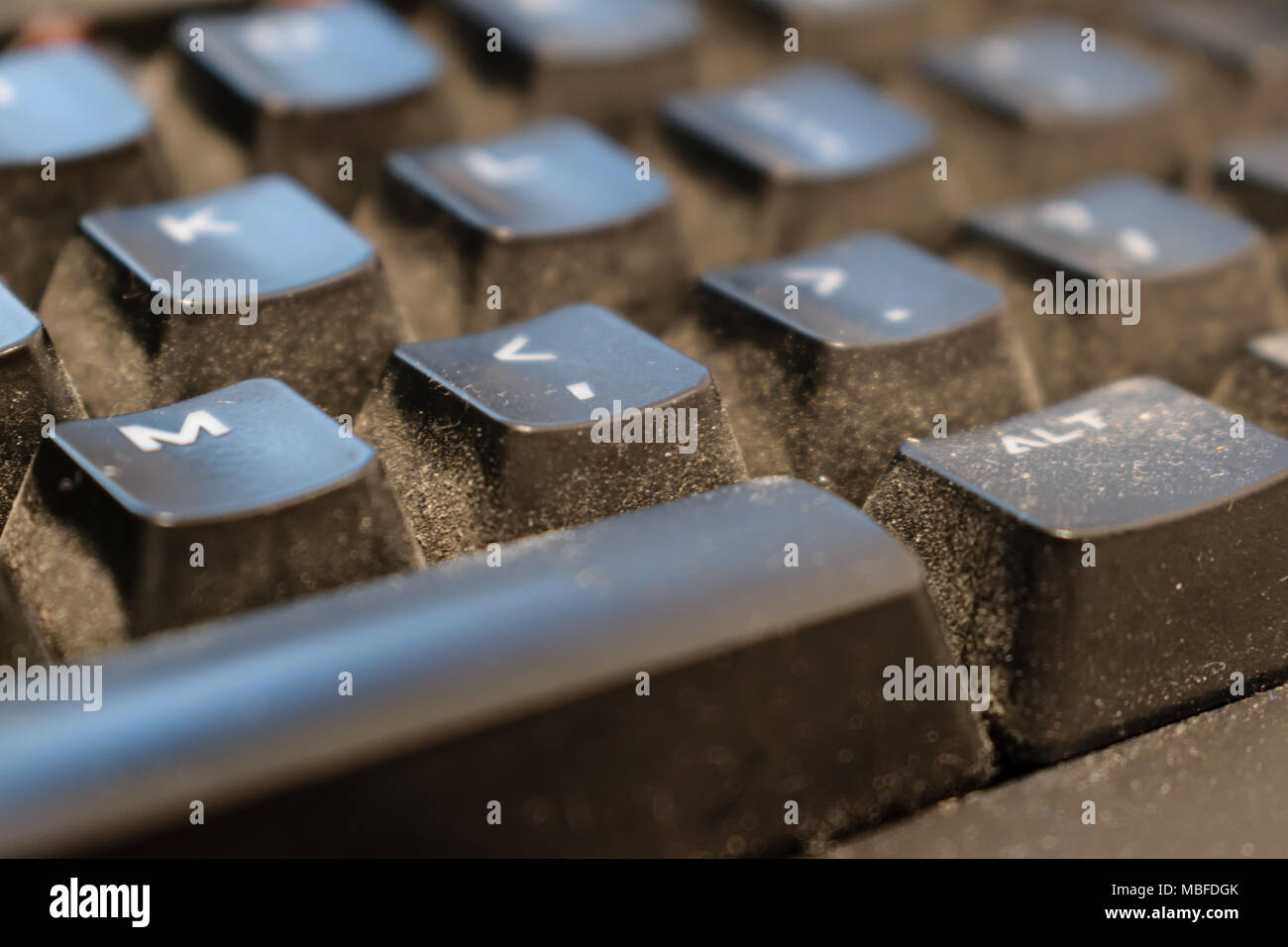 Dirty keyboard keys close up, health, hygiene hazard Stock Photo