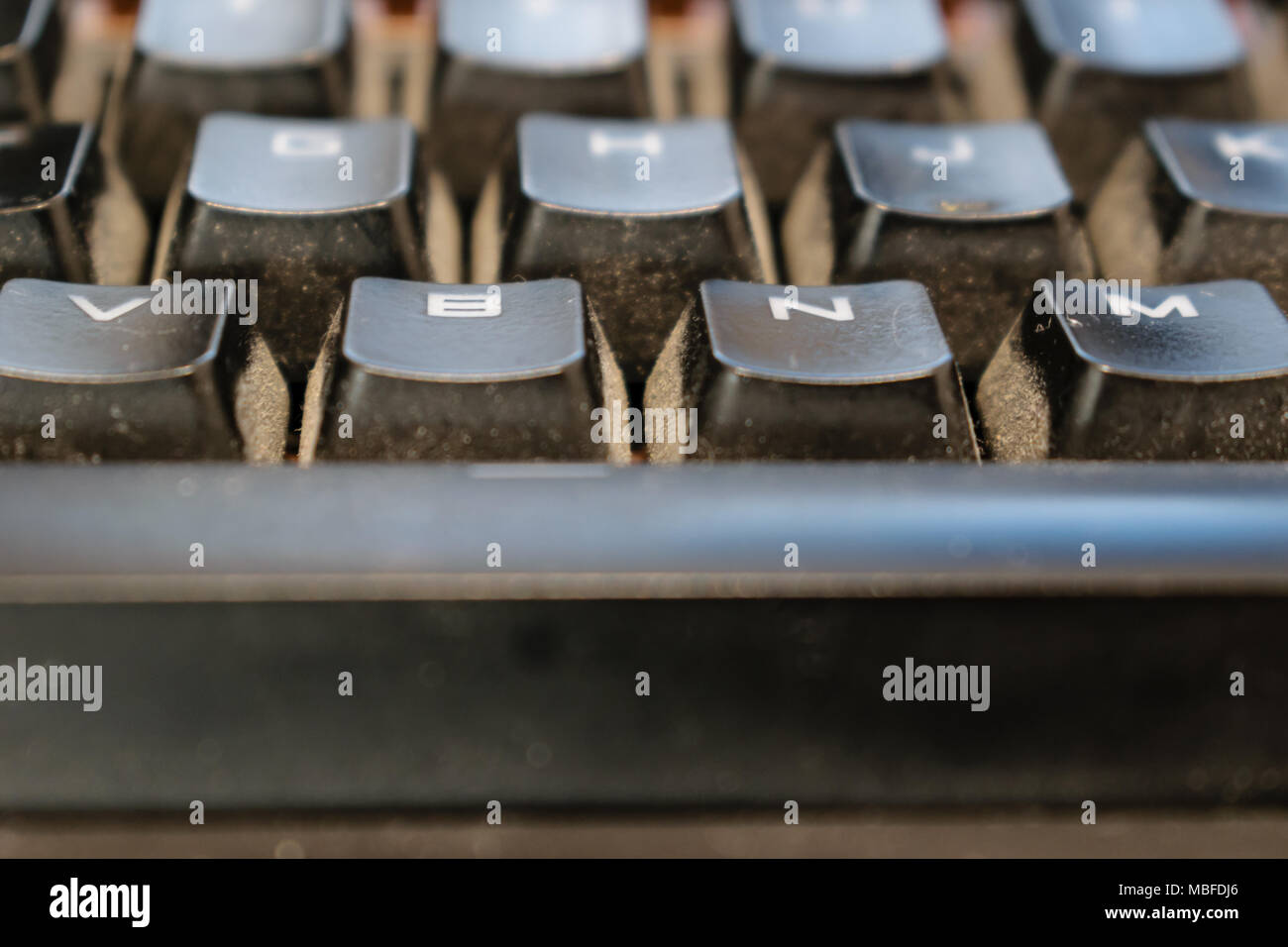 Dirty keyboard keys close up, health, hygiene hazard Stock Photo