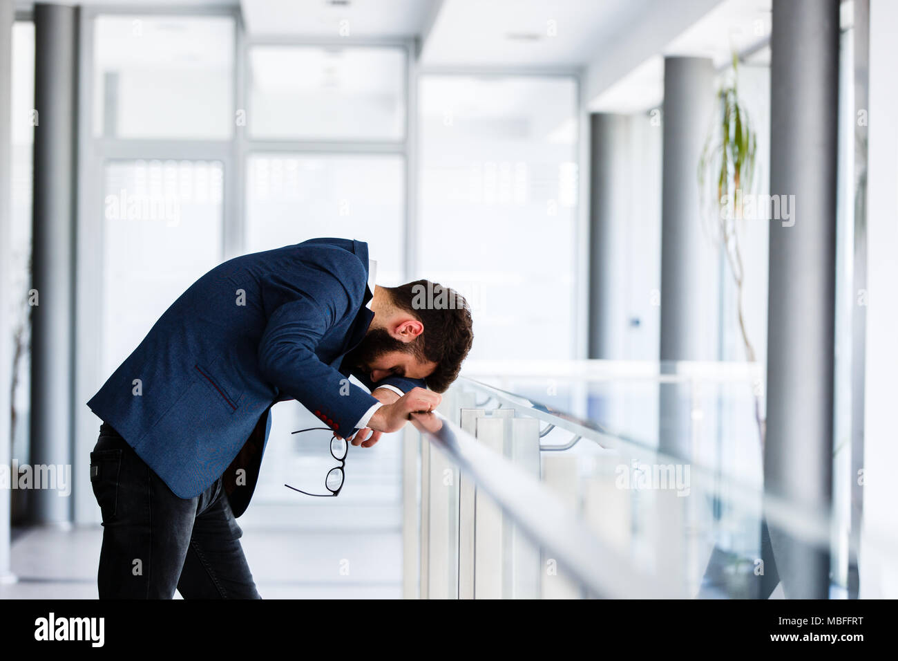 Depressed and sad man on hes job having problems Stock Photo