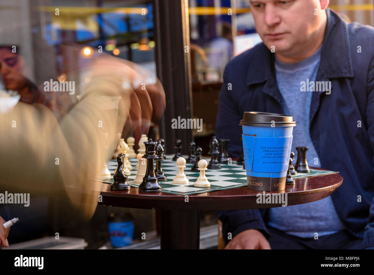 Men play chess on the street during the Belfast Culture Night Stock Photo