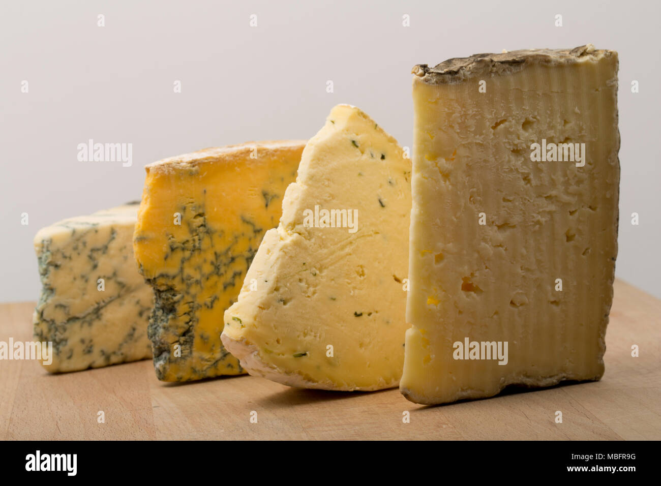A selction of cheeses bought from a supermarket in the UK. Left-to-right: Dorset Blue Vinney, CropwellBishop Nottinghamshire Blue, Sharpham Rustic chi Stock Photo