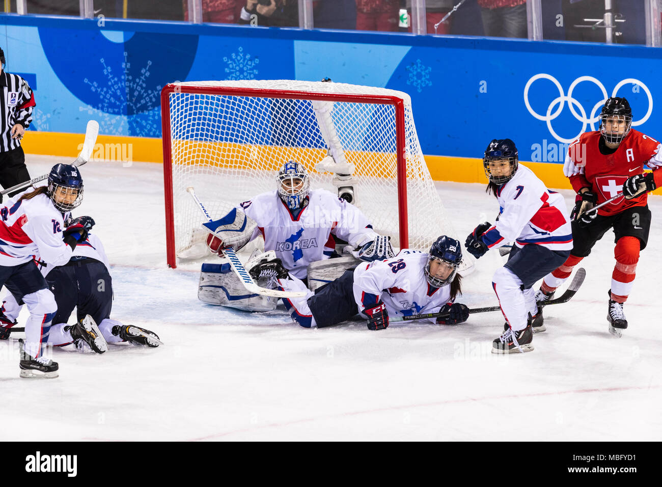 So Jung Shin (KOR) goalie and Jingyu Lee (KOR) #29 during Korea (combinded) vs Switzerland Women's Ice Hockey competition at the Olympic Winter Games  Stock Photo