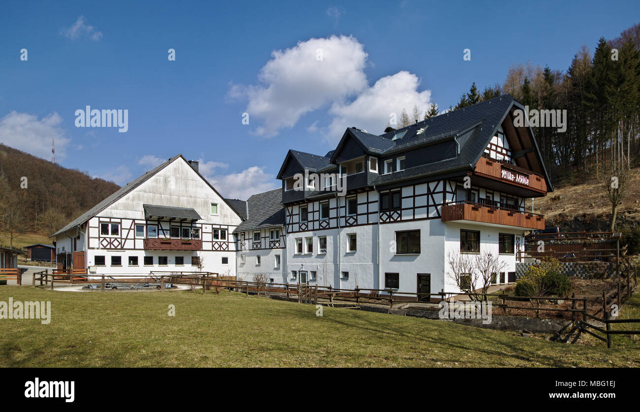 Willingen, Germany - March 27th, 2018 - Traditional timber-framed and whitewashed farm building Stock Photo