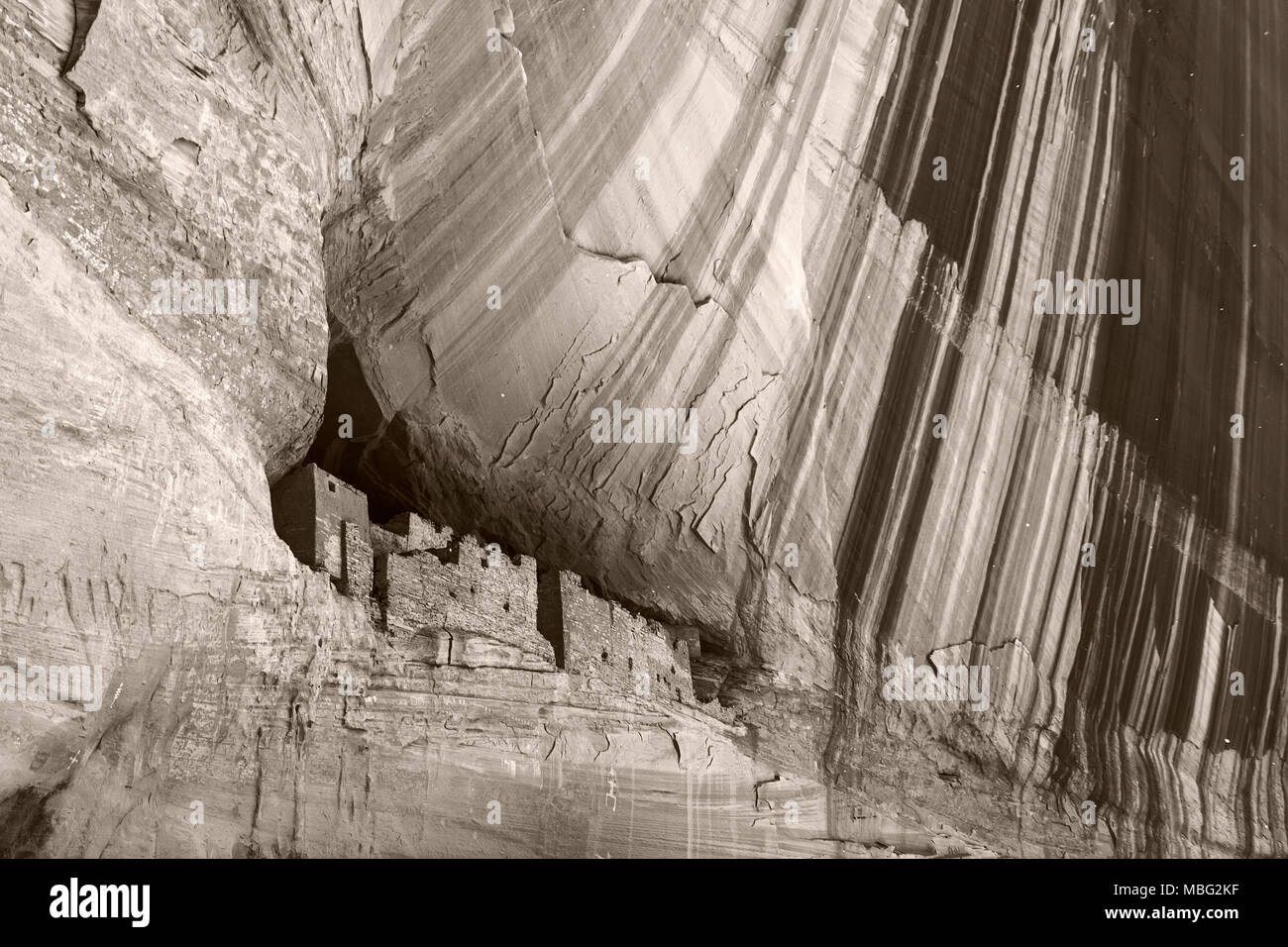 Beautiful black and white monochrome picture of Anazasi cave dwellings built in a cliff in Canyon de Chelly, Chinle, Arizona. Stock Photo