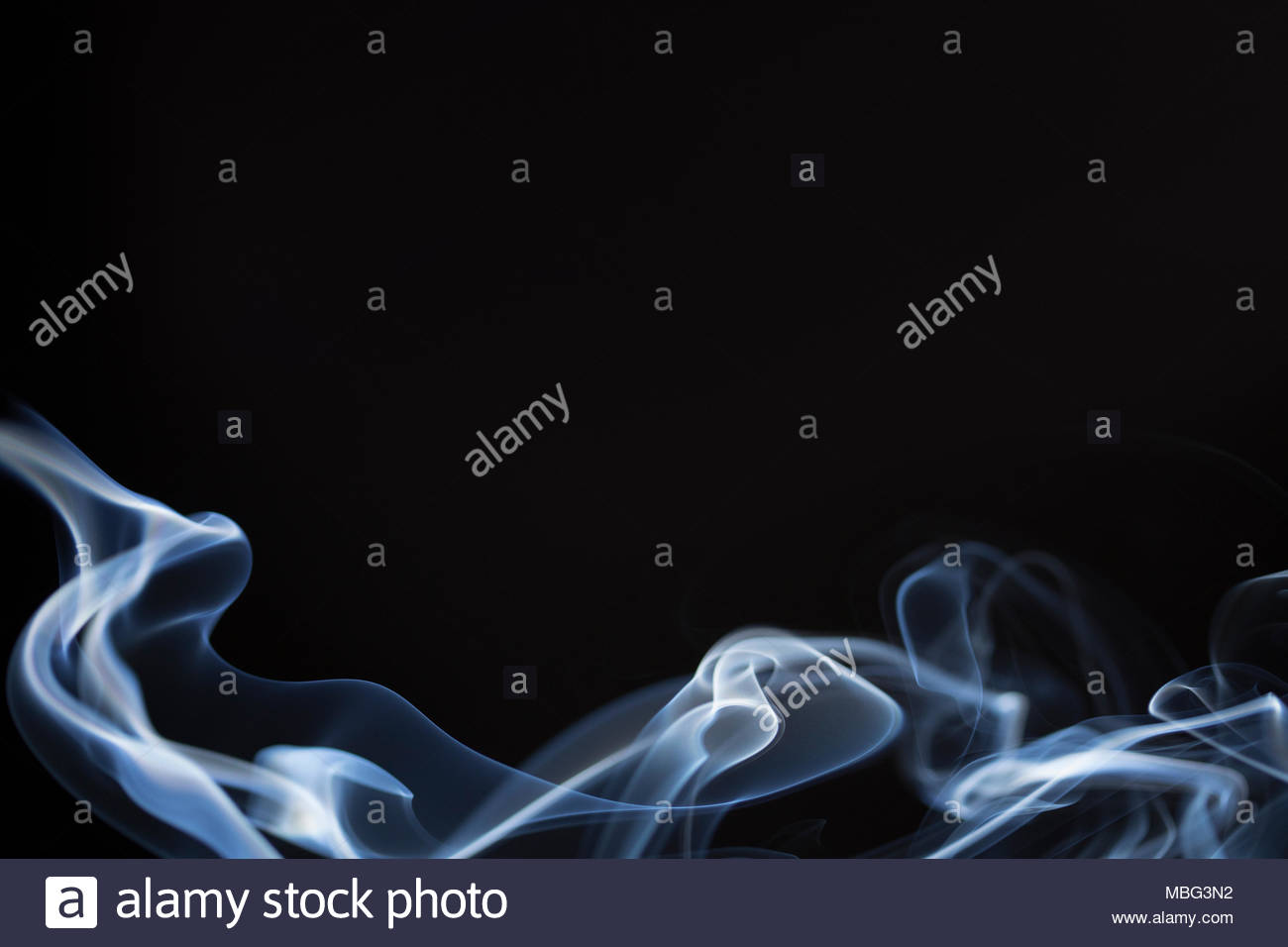 Blue smoke wave on black background Stock Photo