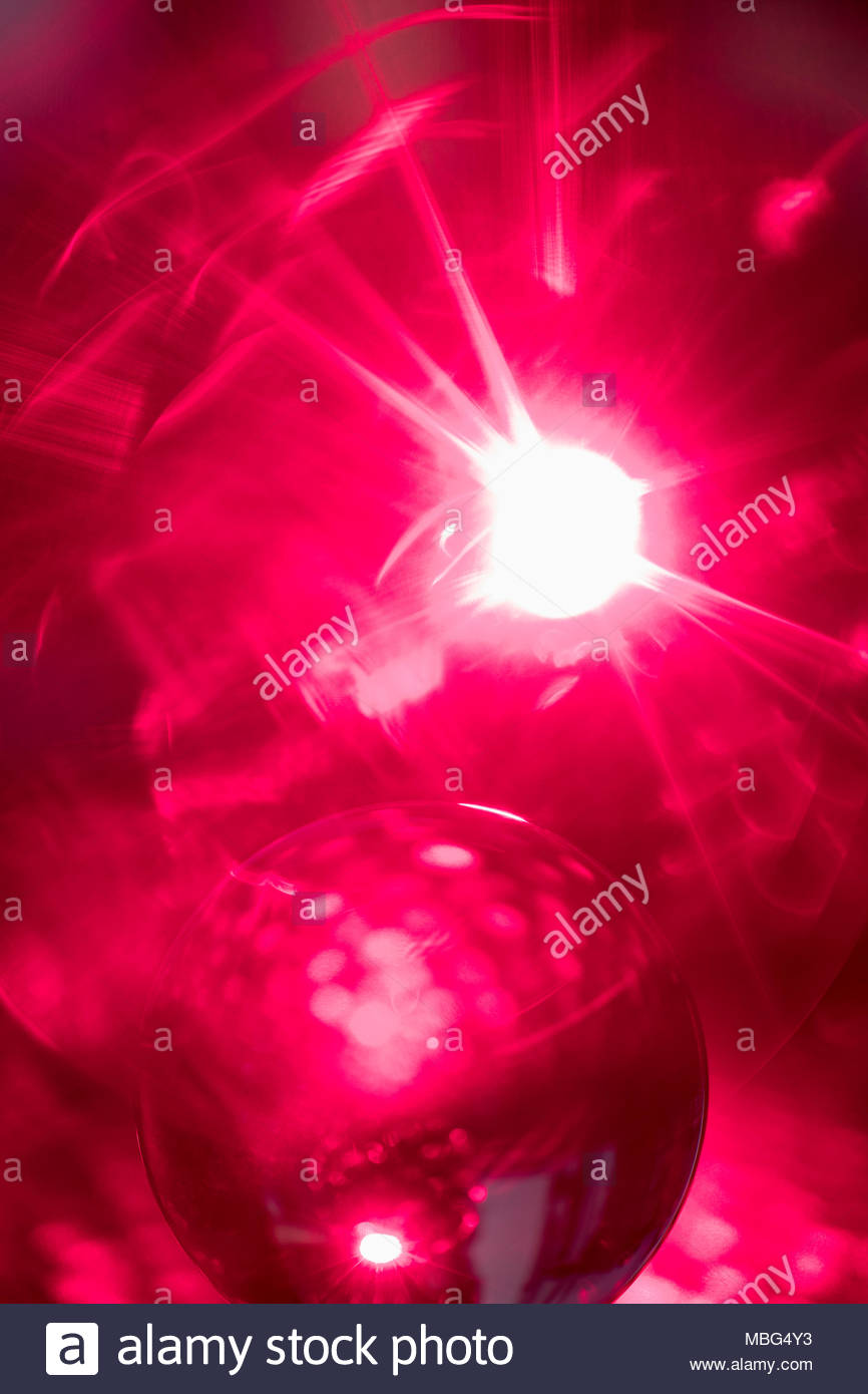 Creative, inspiring abstract solar sphere on bright red background Stock Photo