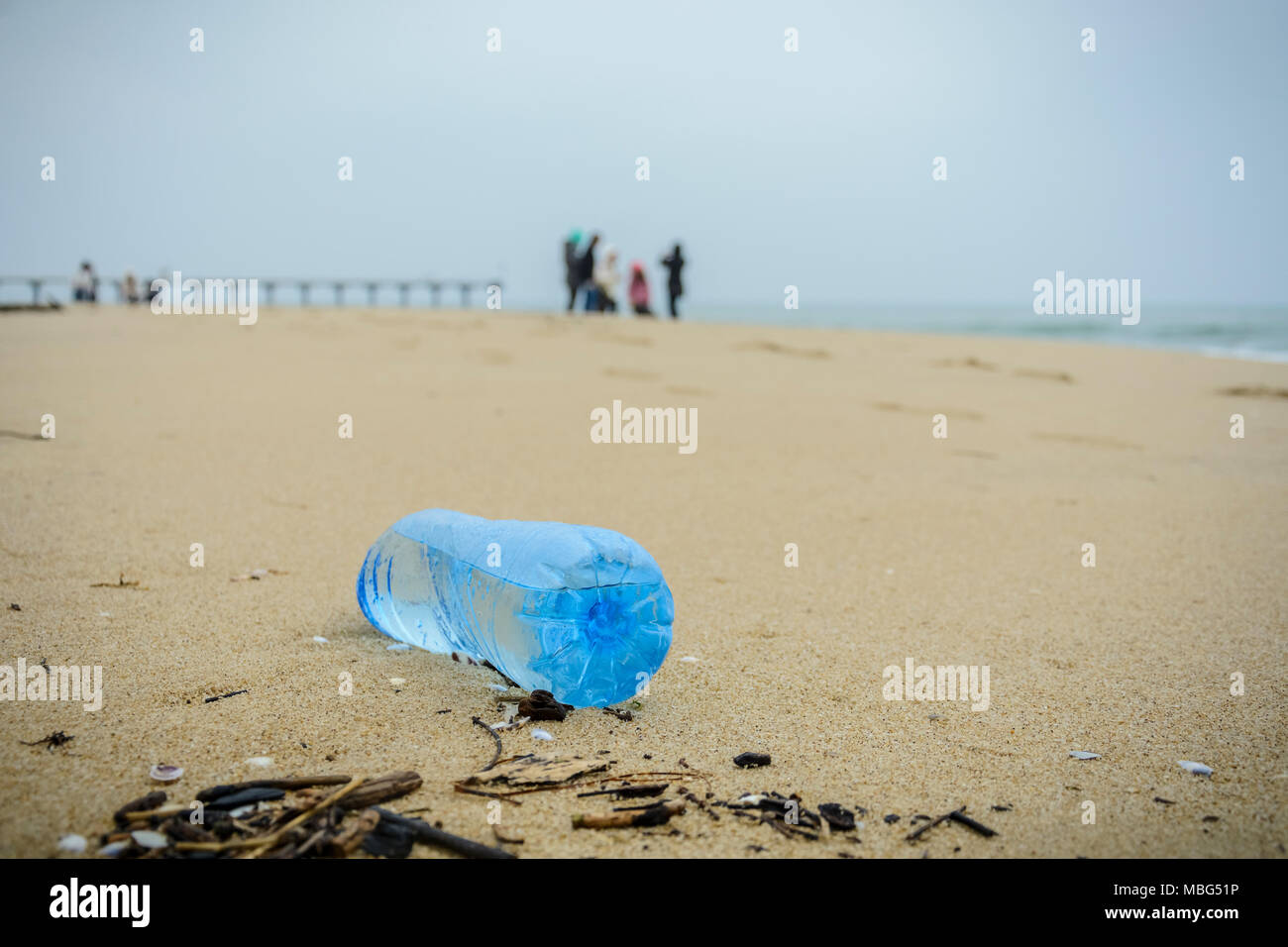 dirty plastic bottle dropped on the beach Stock Photo Alamy