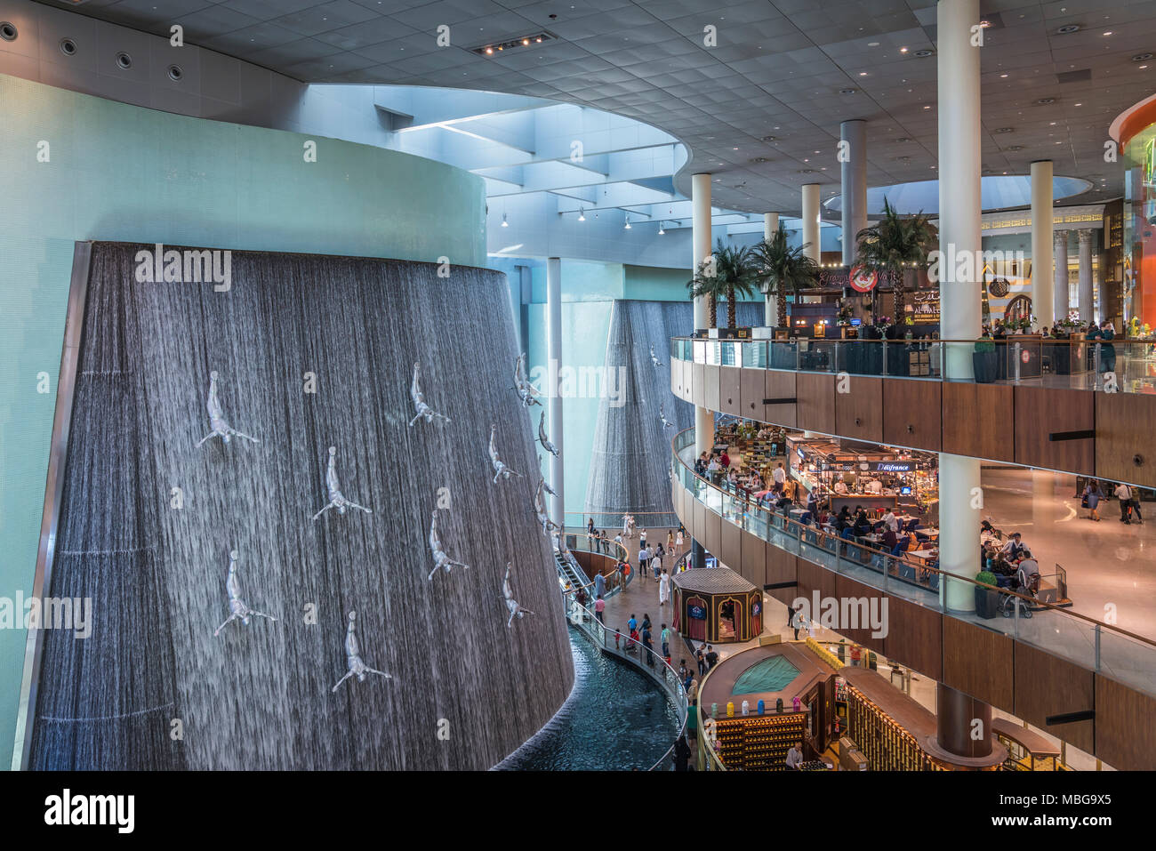 The waterfall and divers at the water wall at the Dubai Mall in