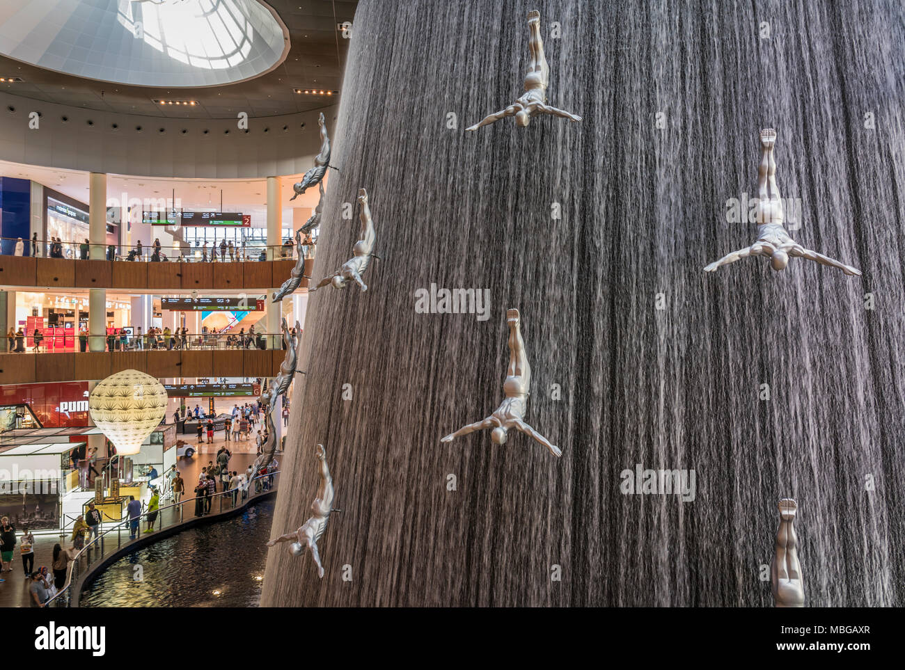 The waterfall and divers at the water wall at the Dubai Mall in