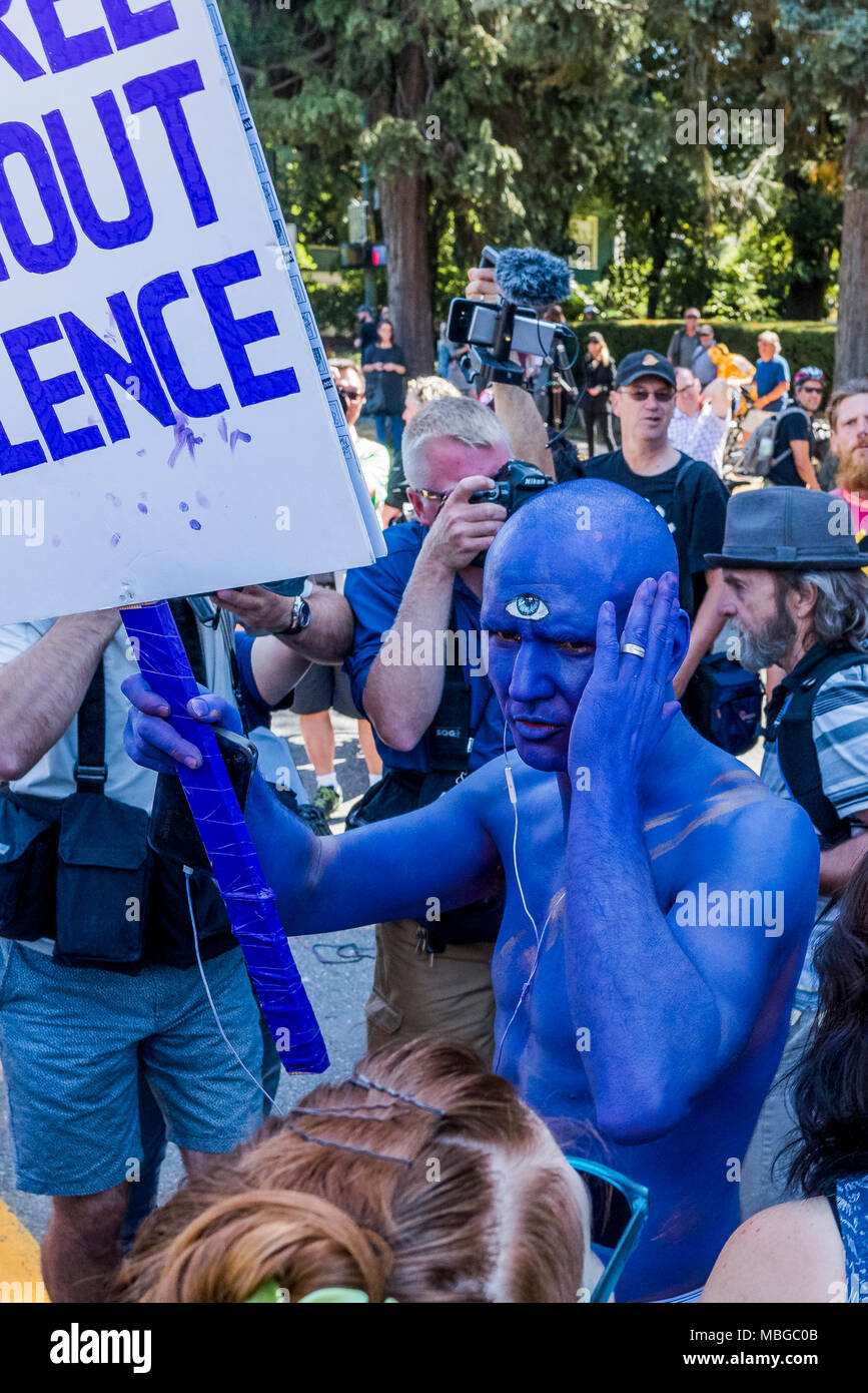 Man with third eye and blue body paint at Anti-Racism Rally, City Hall, Vancouver, British Columbia, Canada. Stock Photo