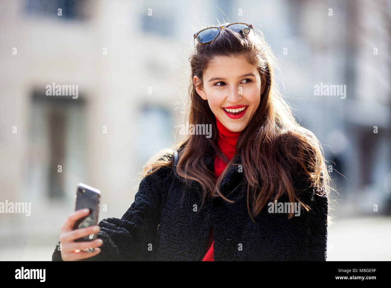 Close up fashion street style portrait of a beautiful girl in a casual ...