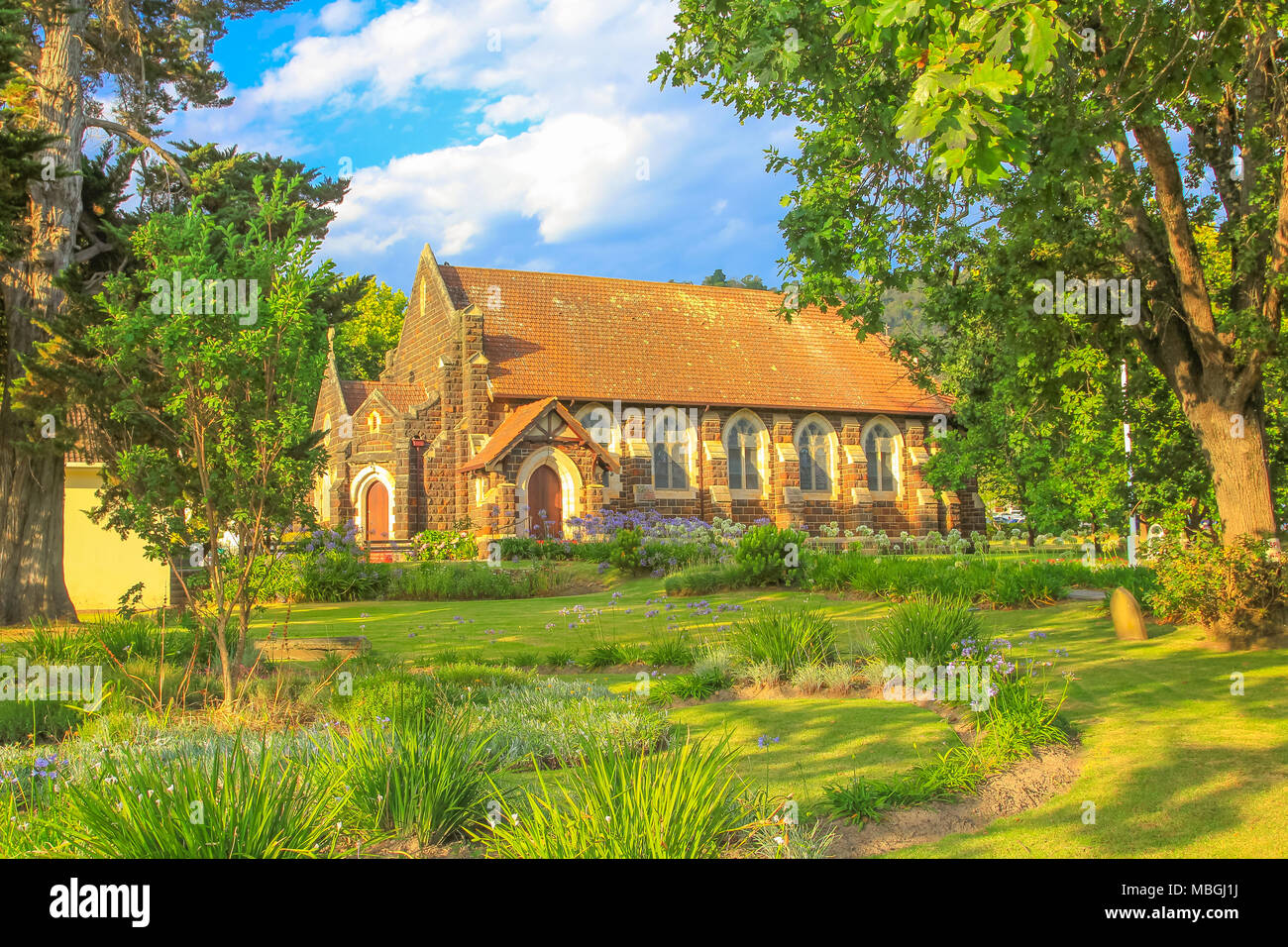 Side view of historic St. Georges Anglican Church in Knysna on the Garden Route in Western Cape, South Africa. The old Church as built in 1855. Sunny day, blue sky. Stock Photo