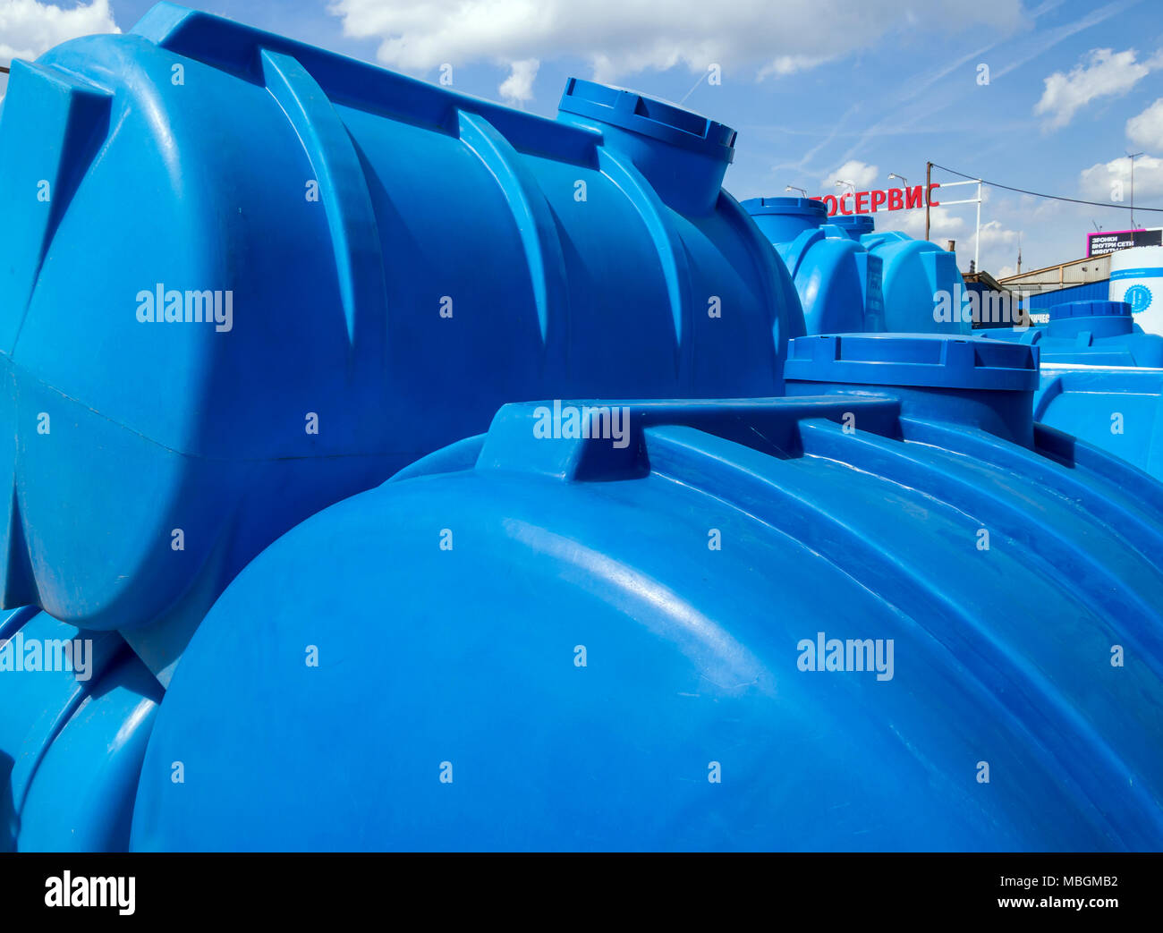 Large blue plastic containers for water and other liquids Stock Photo
