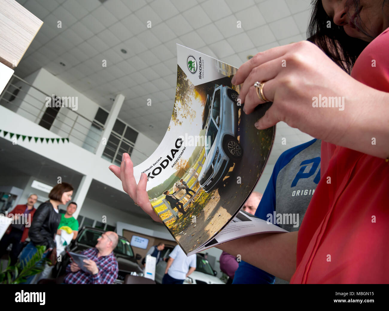 Voronezh, Russia - June 04, 2017: The new catalog of the car Skoda Kodiaq in the hands of the visitor Stock Photo