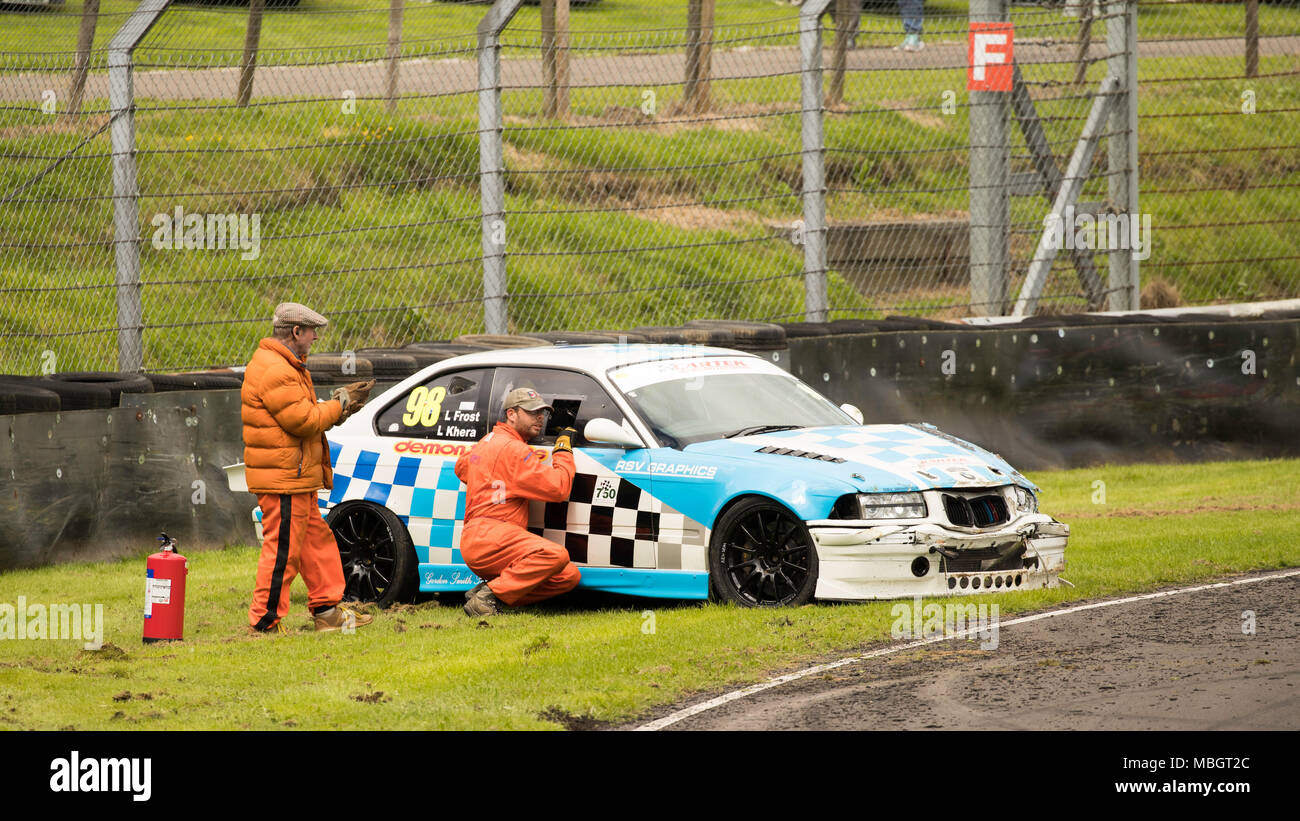 Track Marshals in action at Tower corner, Castle Combe Circuit, Wiltshire, UK Stock Photo