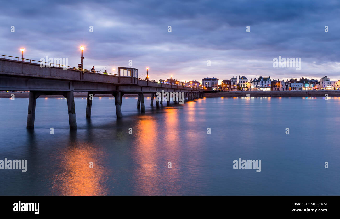 Looking inland from the end of Deal Pier at dusk. Stock Photo