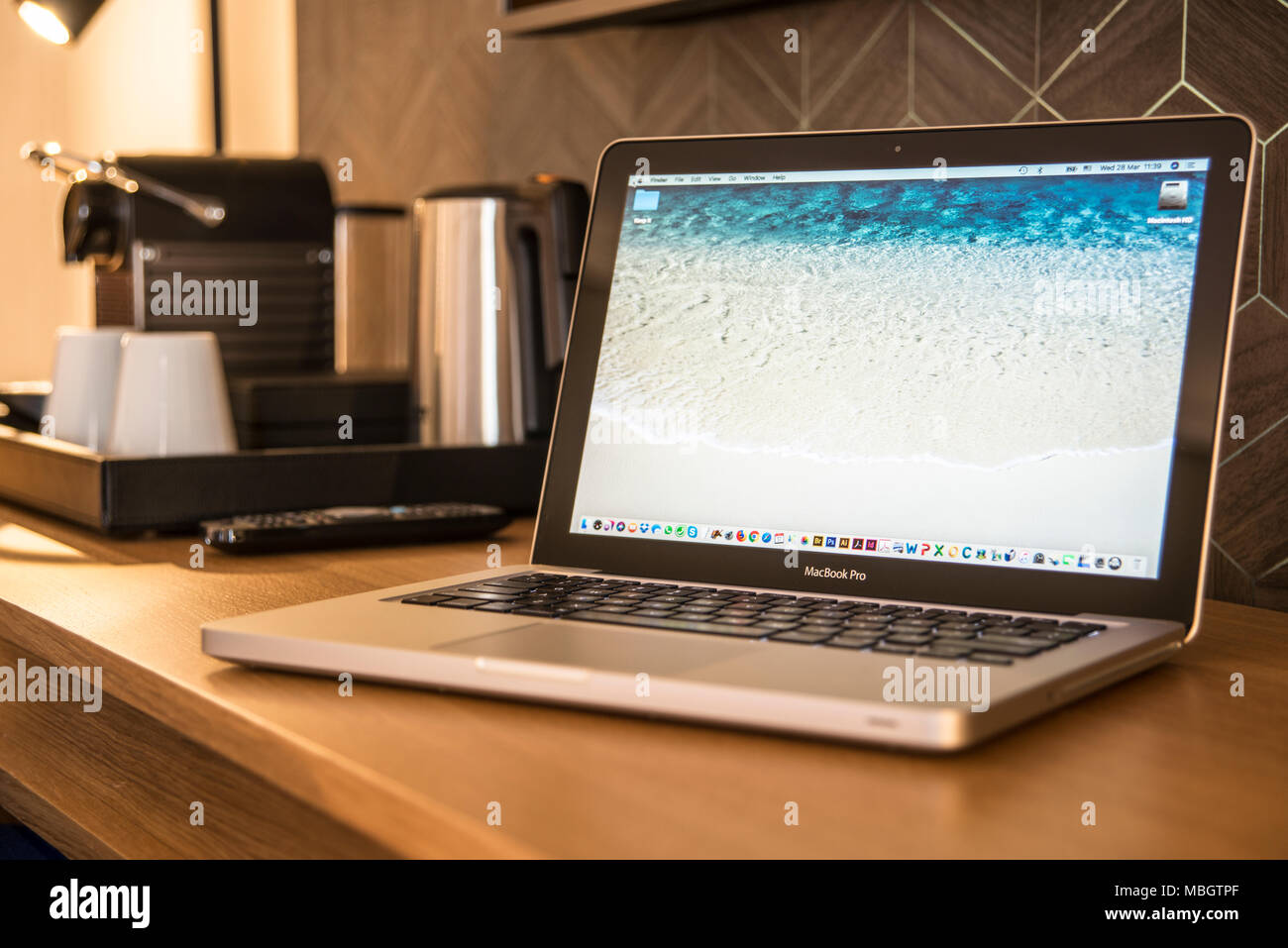 Laptop on hotel desk Stock Photo Alamy