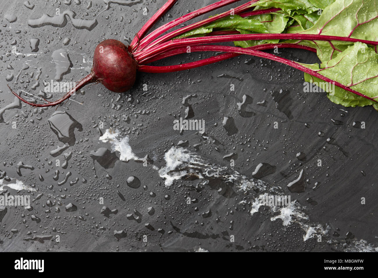 Fresh harvested beetroot on stone background, top view Stock Photo