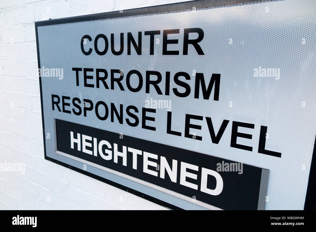 Warning sign at the historic Naval dockyard, Portsmouth, to show heightened counter terrorism threat level in force at that time on the Naval base. UK Stock Photo