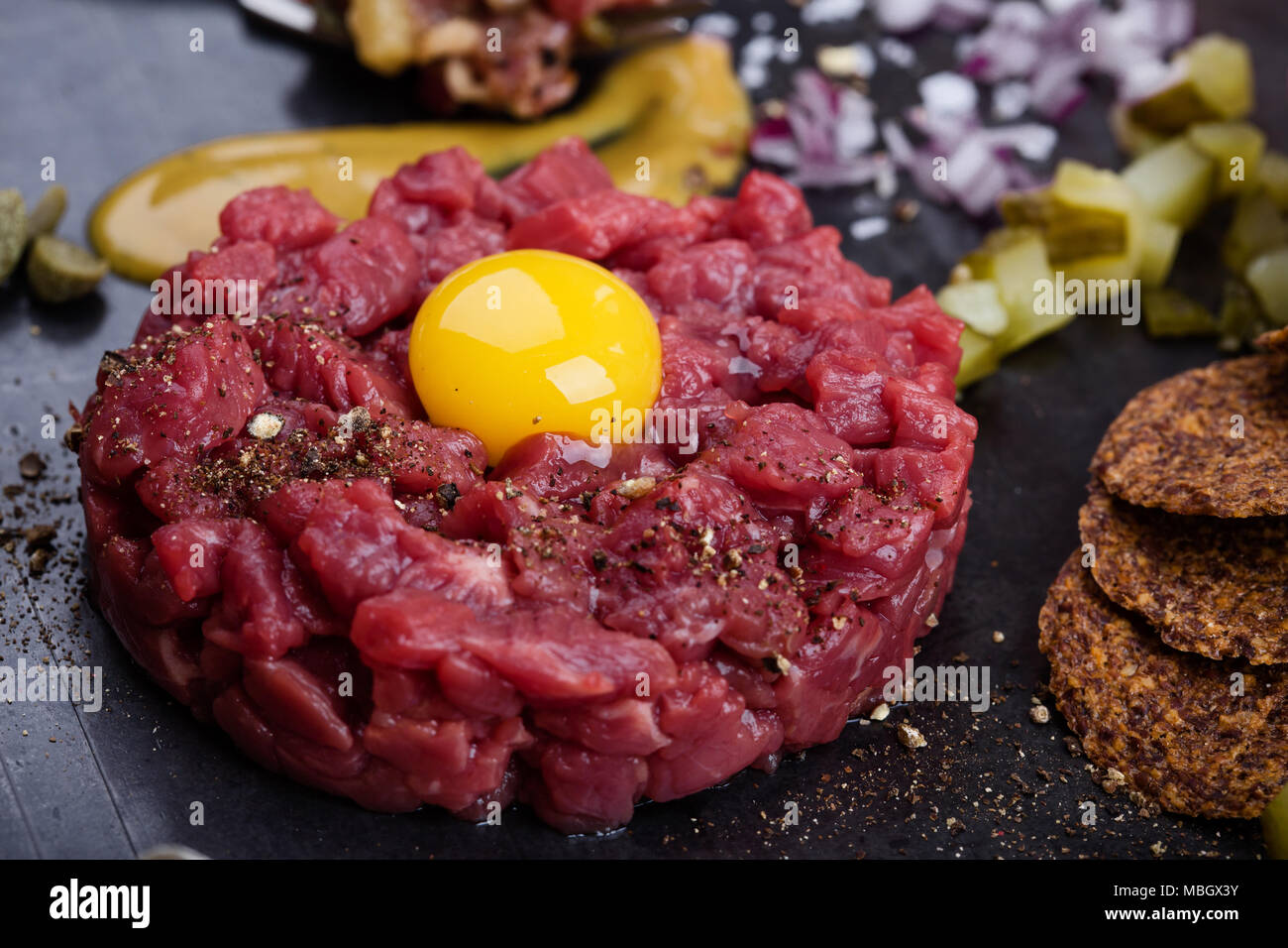 Steak tartare, gourmet delicacy raw meat starter. Minced beef dish with