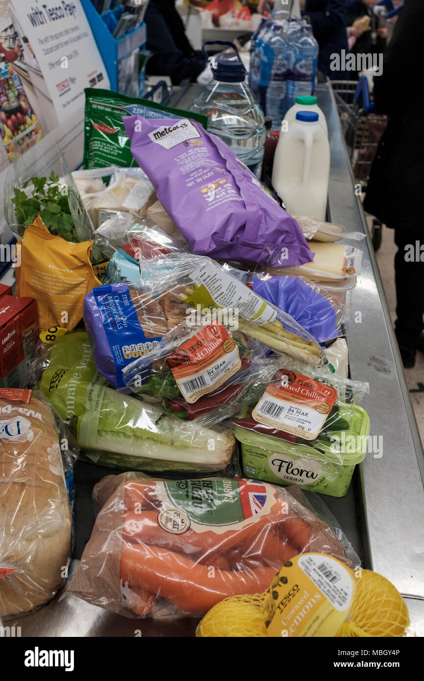 Shopping in Tesco supermarket, plastic packaging Stock Photo