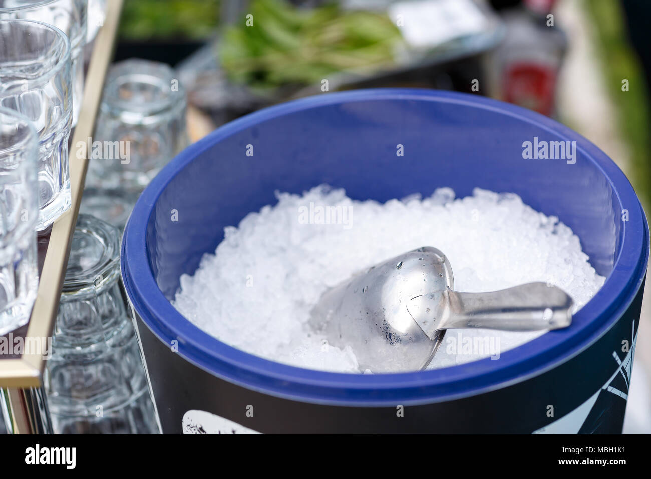 Ice Tube in Ice Bucket. Pieces of ice on a glass tray. The view from