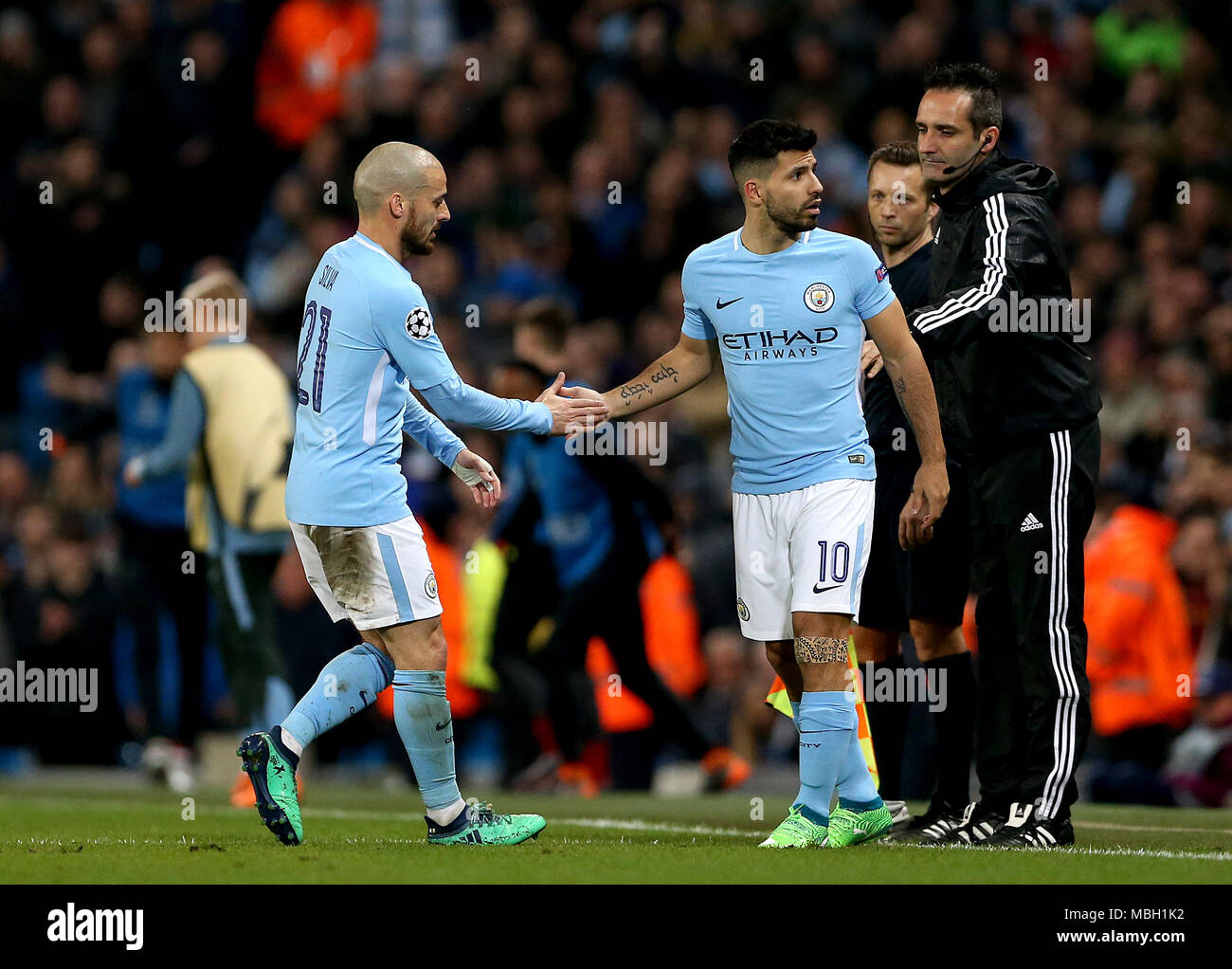 Manchester City's Sergio Aguero (centre) is substituted on for David Silva (left) during the UEFA Champions League, Quarter Final at the Etihad Stadium, Manchester. Stock Photo
