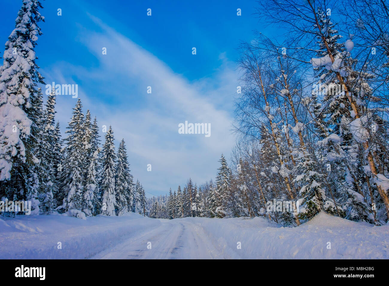 Outdoor view of winter road covered with heavy snow and ice in the ...
