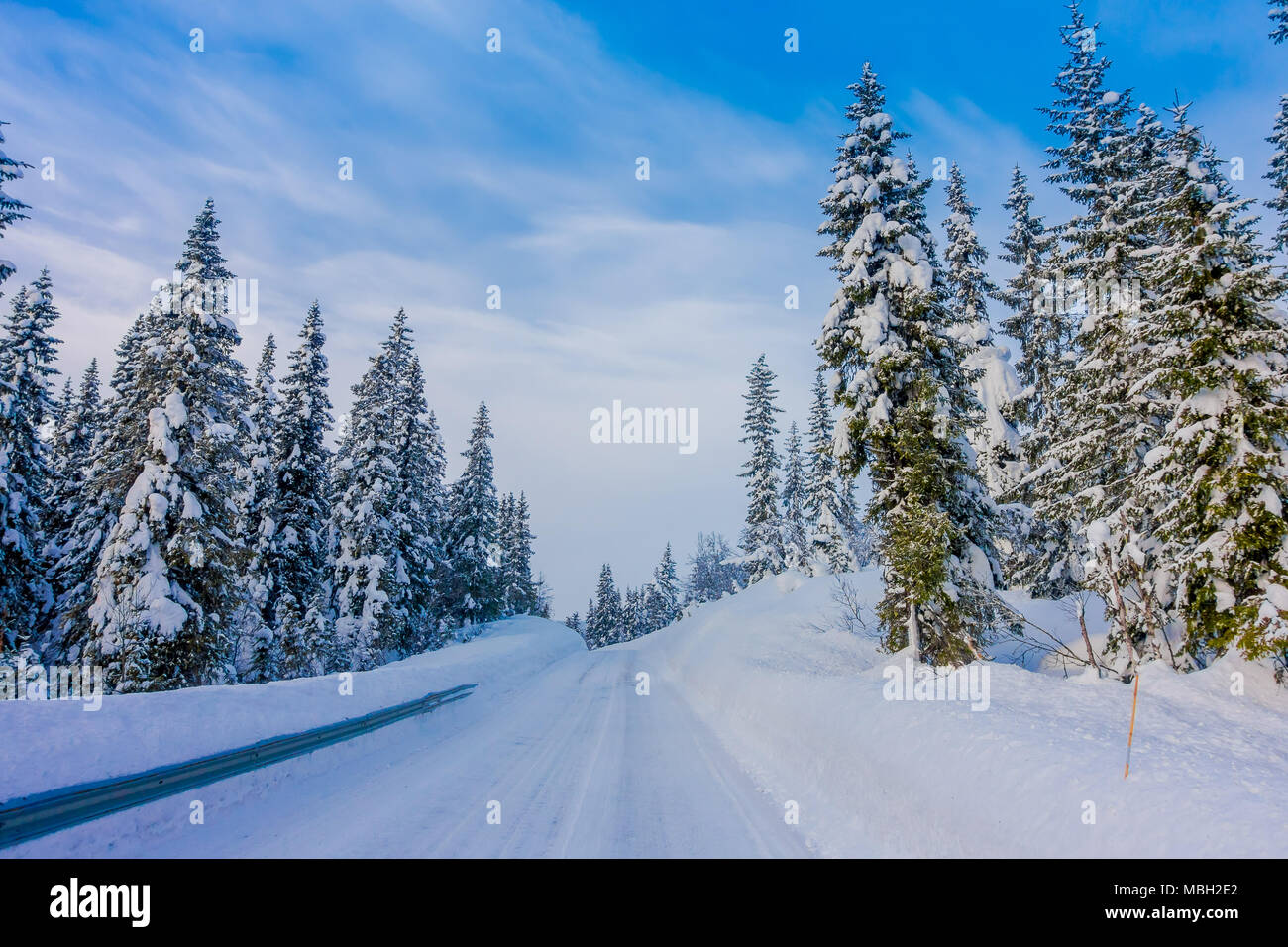 Beautiful outdoor view of road partial covered with heavy snow, and ...