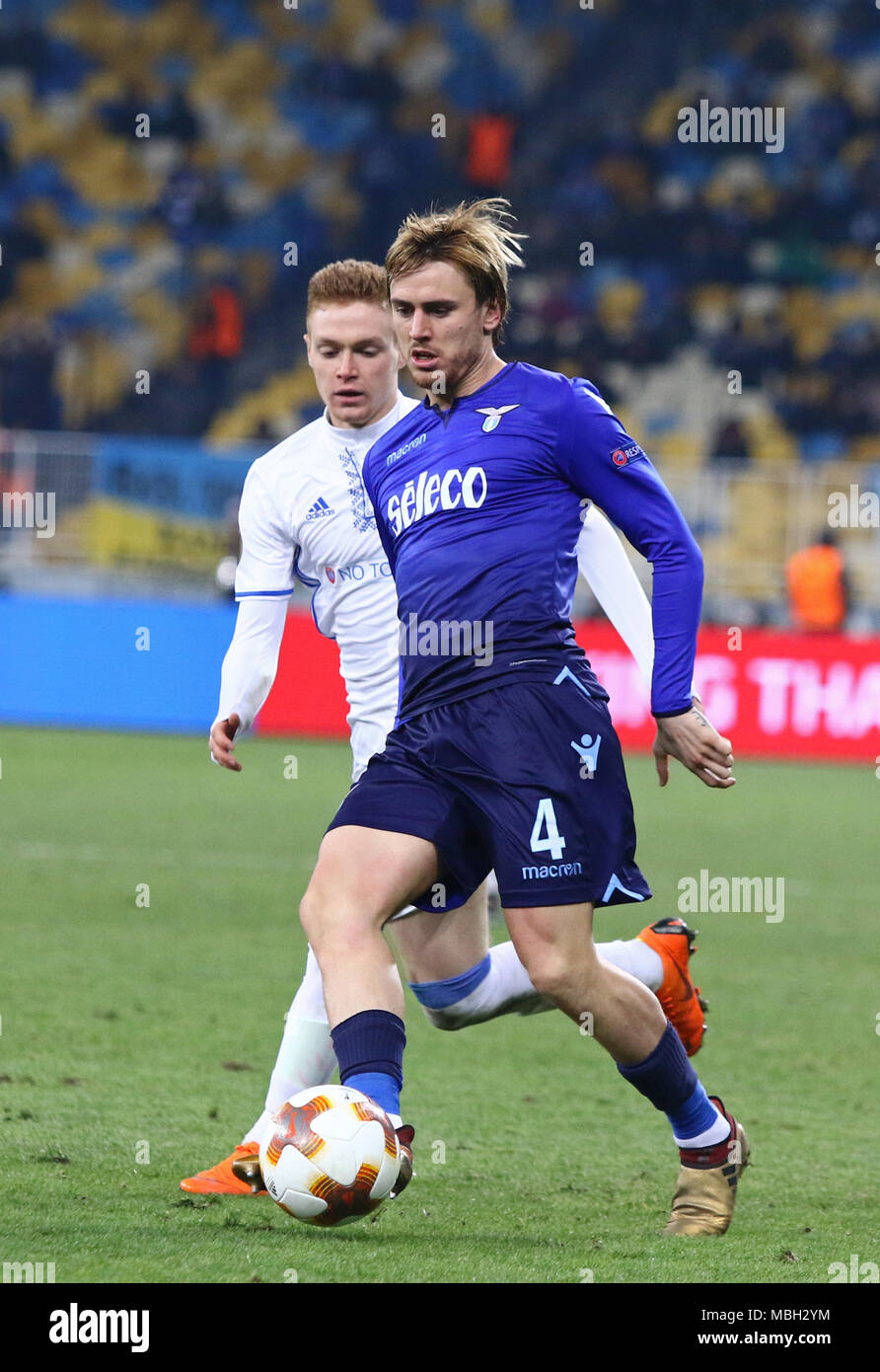 KYIV, UKRAINE - MARCH 15, 2018: Patric of SS Lazio (R) fights for a ball with Viktor Tsygankov of Dynamo Kyiv during their UEFA Europa League Round of Stock Photo