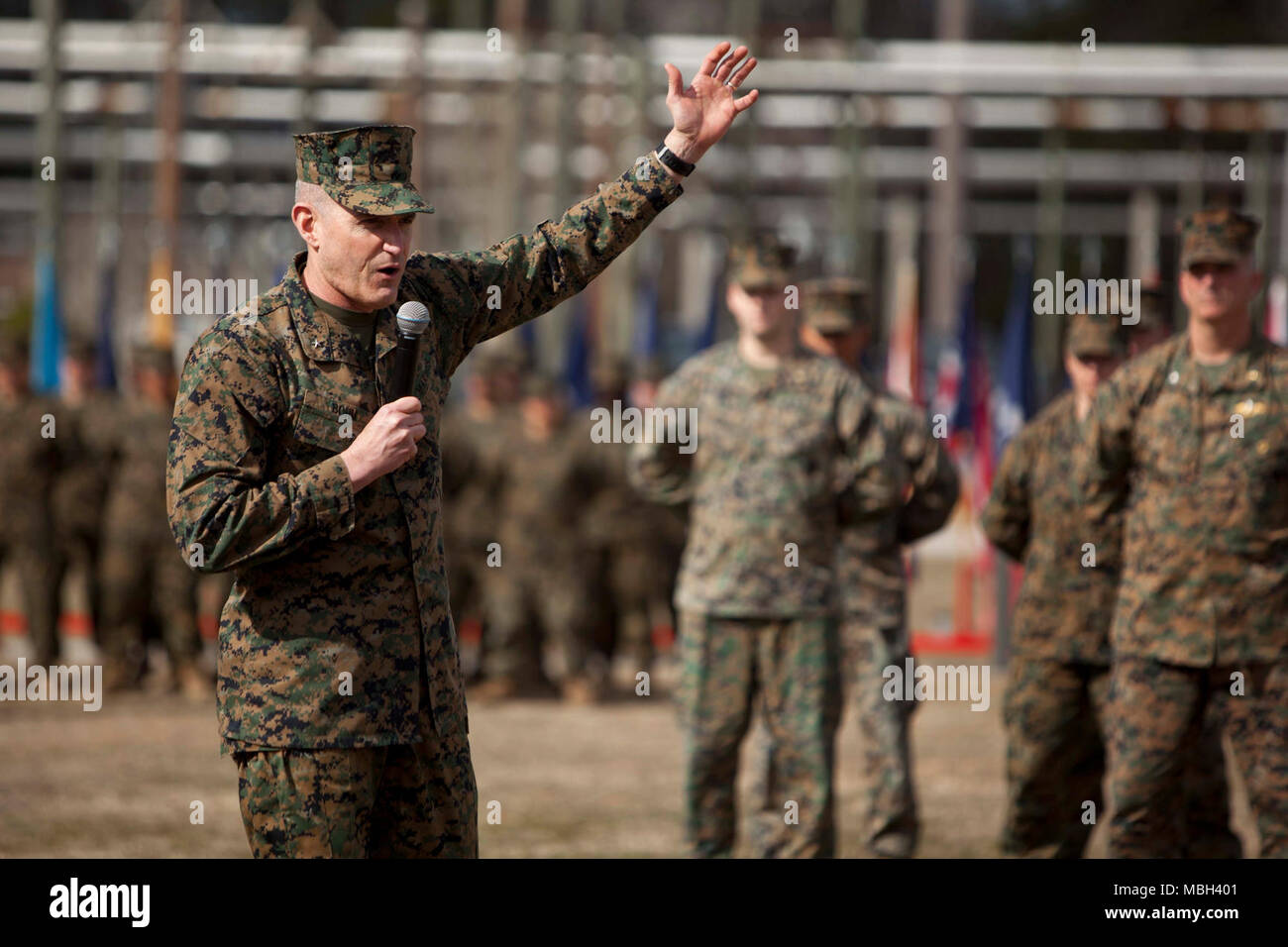 U.S. Marine Corps Training Command Command General Brig. Gen. Jason Q. Bohm, addresses Marines and Sailors during the Field Medical Training Battalion-East (FMTB-E) change of command ceremony at Camp Johnson, N.C., Jan. 9, 2018. The change of command ceremony is a time-honered tradition in which one commander reliquishes command to another. Stock Photo