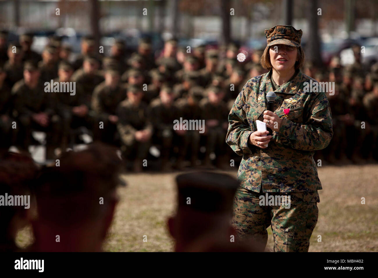 U.S. Navy Capt. Jennifer E. Smith, the off going commanding officer for Field Medical Training Battalion-East (FMTB-E) addresses Marines and Sailors during the FMTB-E Change of Command ceremony at Camp Johnson, N.C., Jan. 9, 2018. The change of command ceremony is a time-honered tradition in which one commander reliquishes command to another. Stock Photo
