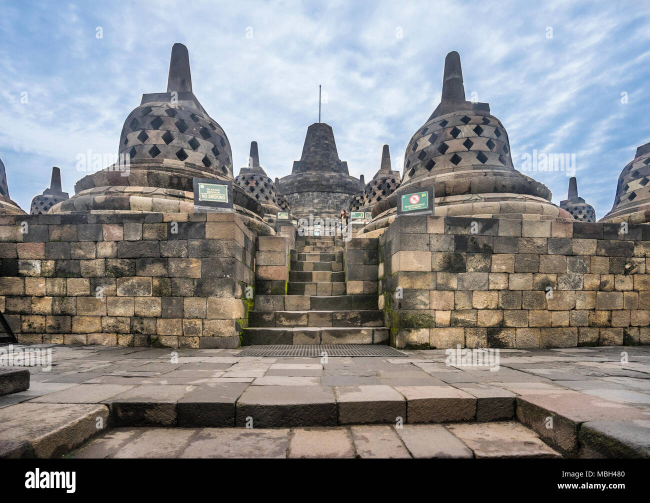perforated stupas containing Buddha statues on the circular top terraces of 9th century Borobudur Buddhist temple, Central Java, Indonesia Stock Photo