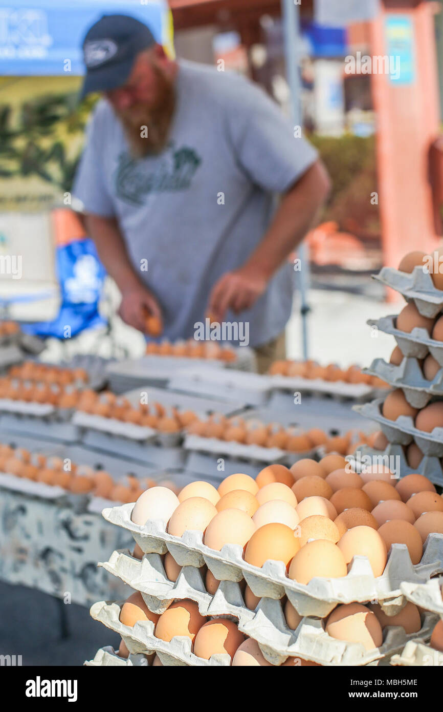 Roger Thomas, co-owner, Thomas Farms, places eggs from his farm into dozen batches in preparation to sell during the 18th Annual Car Show and Street Fair, which was hosted by the Twentynine Palms Chamber of Commerce in Twentynine Palms, Calif., March 31, 2018. The annual event is used to bring the community of Twentynine Palms and the Marine Corps Air Ground Combat Center, located in Twentynine Palms, together as well as support local businesses. Stock Photo