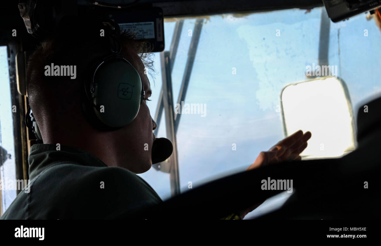U.S. 5TH FLEET AREA OF OPERATIONS (April 2, 2018) Quartermaster 1st Class Eric Waters, assigned to Assault Craft Unit (ACU) 4, points to a landing zone for a landing craft, air cushion after departing from the well deck of the Wasp-class amphibious assault ship USS Iwo Jima (LHD 7) during Alligator Dagger. Led by Naval Amphibious Force, Task Force 51/5th Marine Expeditionary Expedition Brigade, Alligator Dagger integrates U.S. Navy and Marine Corps assets to practice and rehearse a range of critical combat-related capabilities available to U.S. Central Command both afloat and ashore to promote Stock Photo