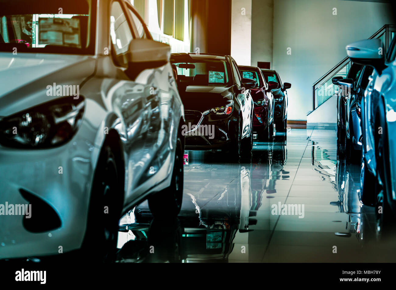 New luxury compact car parked in modern showroom for sale. Car