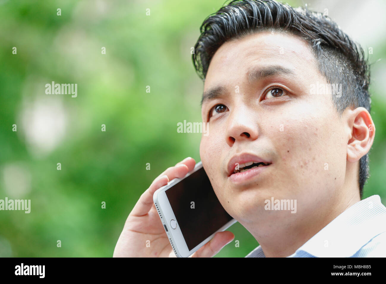 Young Japanese businessman downtown Tokyo Stock Photo