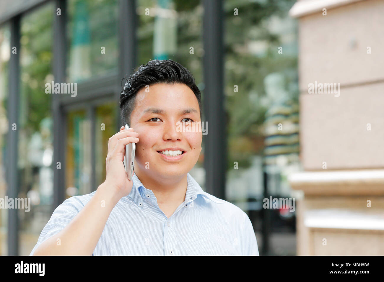 Young Japanese businessman downtown Tokyo Stock Photo